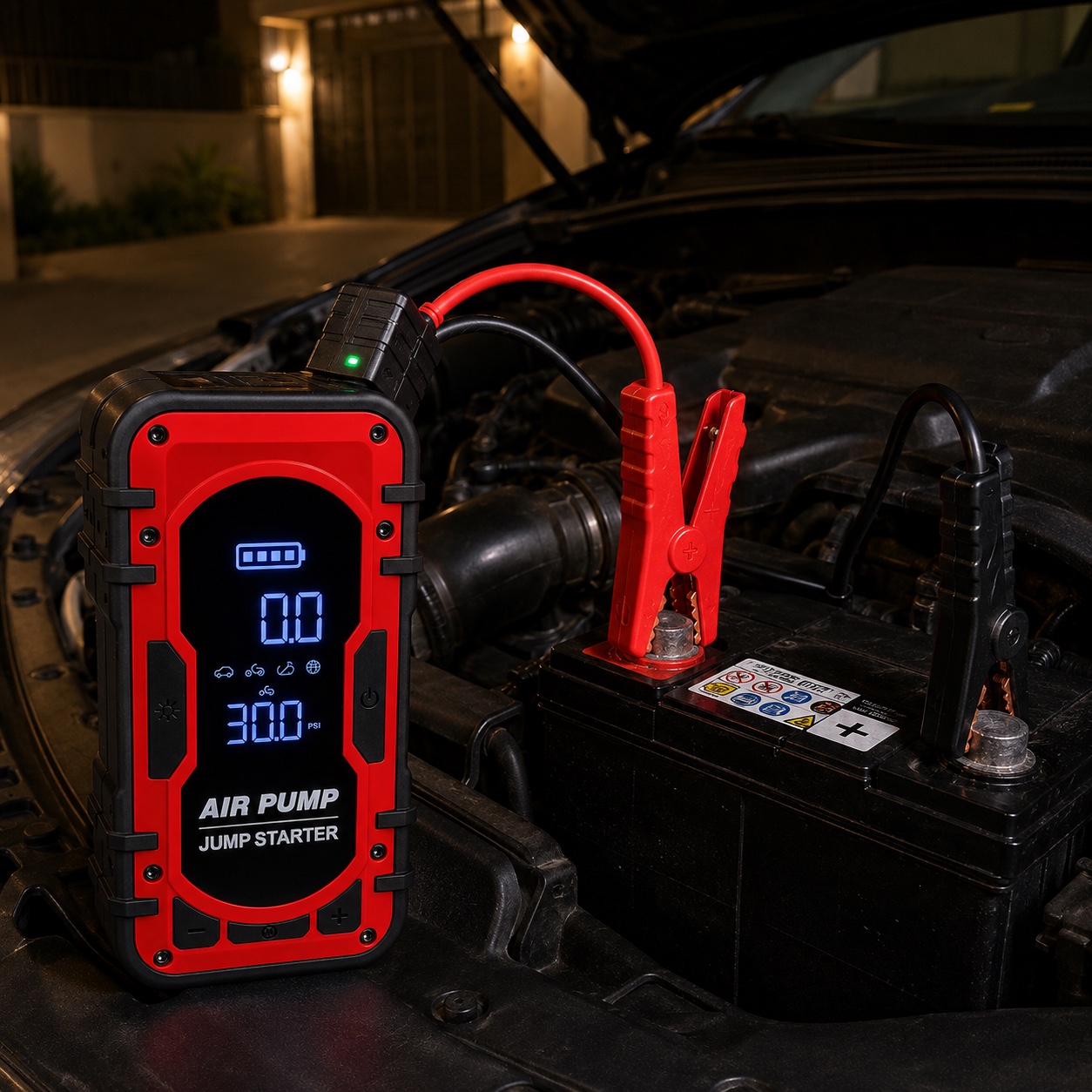 Red / Black RoadGuard connected to a vehicle battery with its clamps